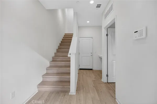a view of entryway with wooden floor
