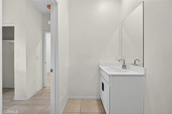 a bathroom with a sink and mirror
