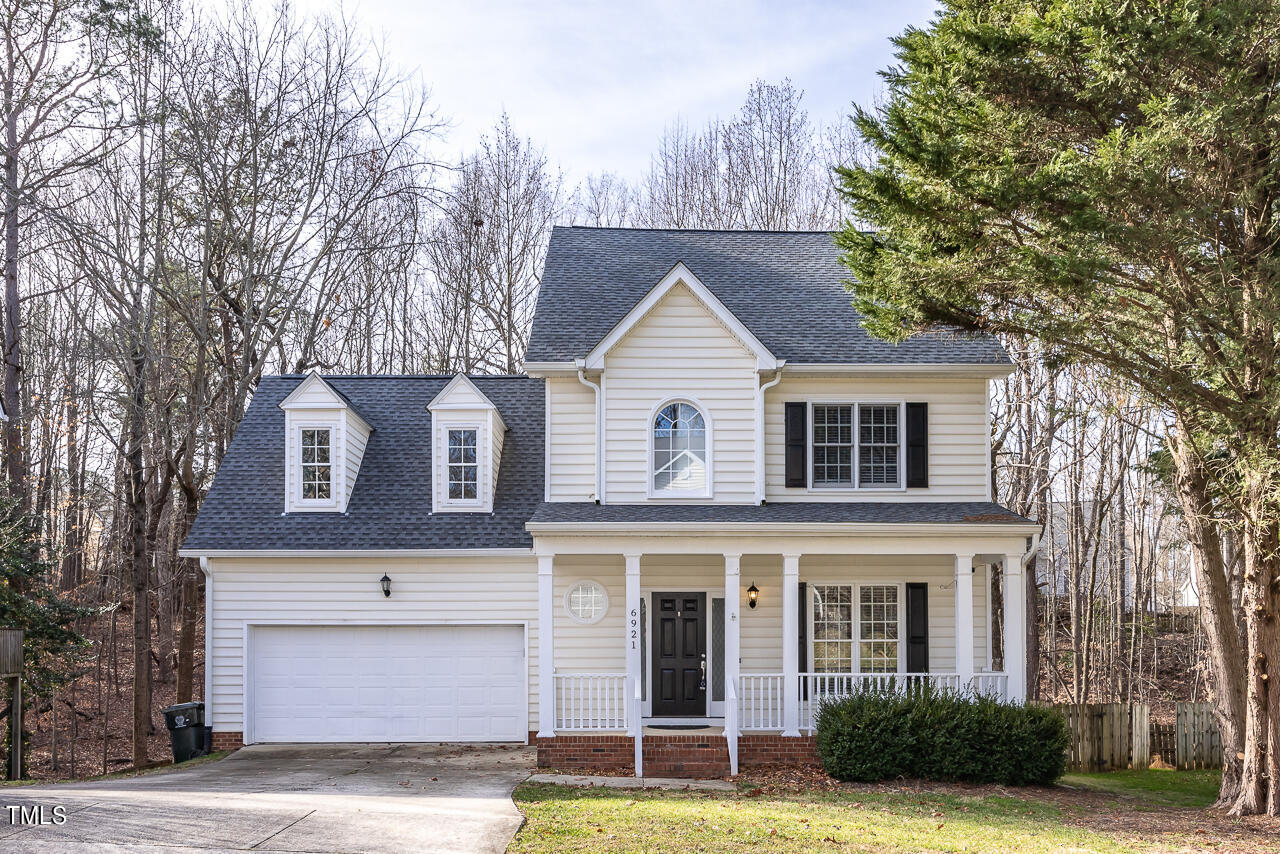 6921 Lamarsh Court Raleigh, NC 27617 - Photo 1 of 37 a front view of a house with a garden
