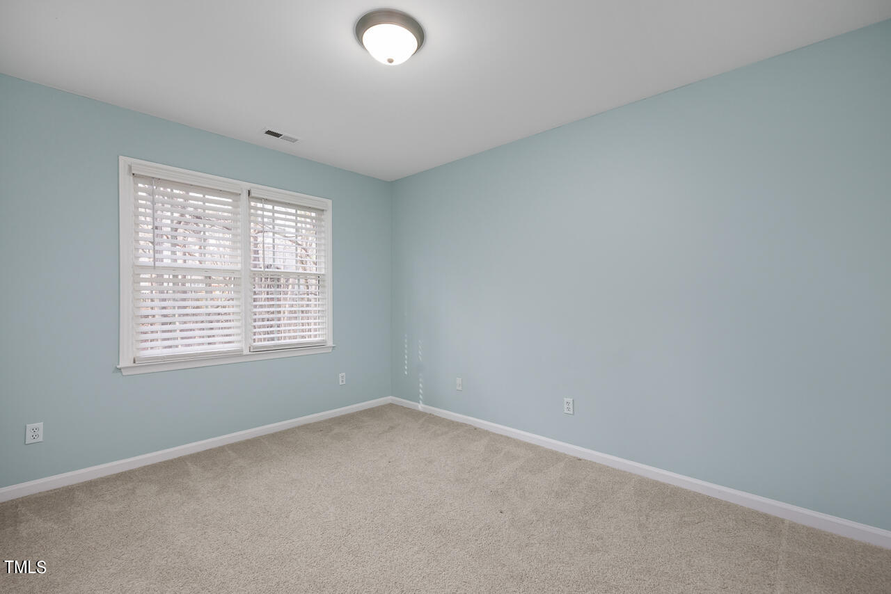 6921 Lamarsh Court Raleigh, NC 27617 - Photo 22 of 37 an empty room with a window