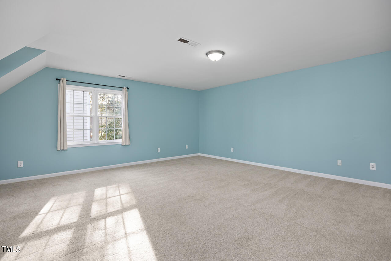 6921 Lamarsh Court Raleigh, NC 27617 - Photo 24 of 37 an empty room with windows