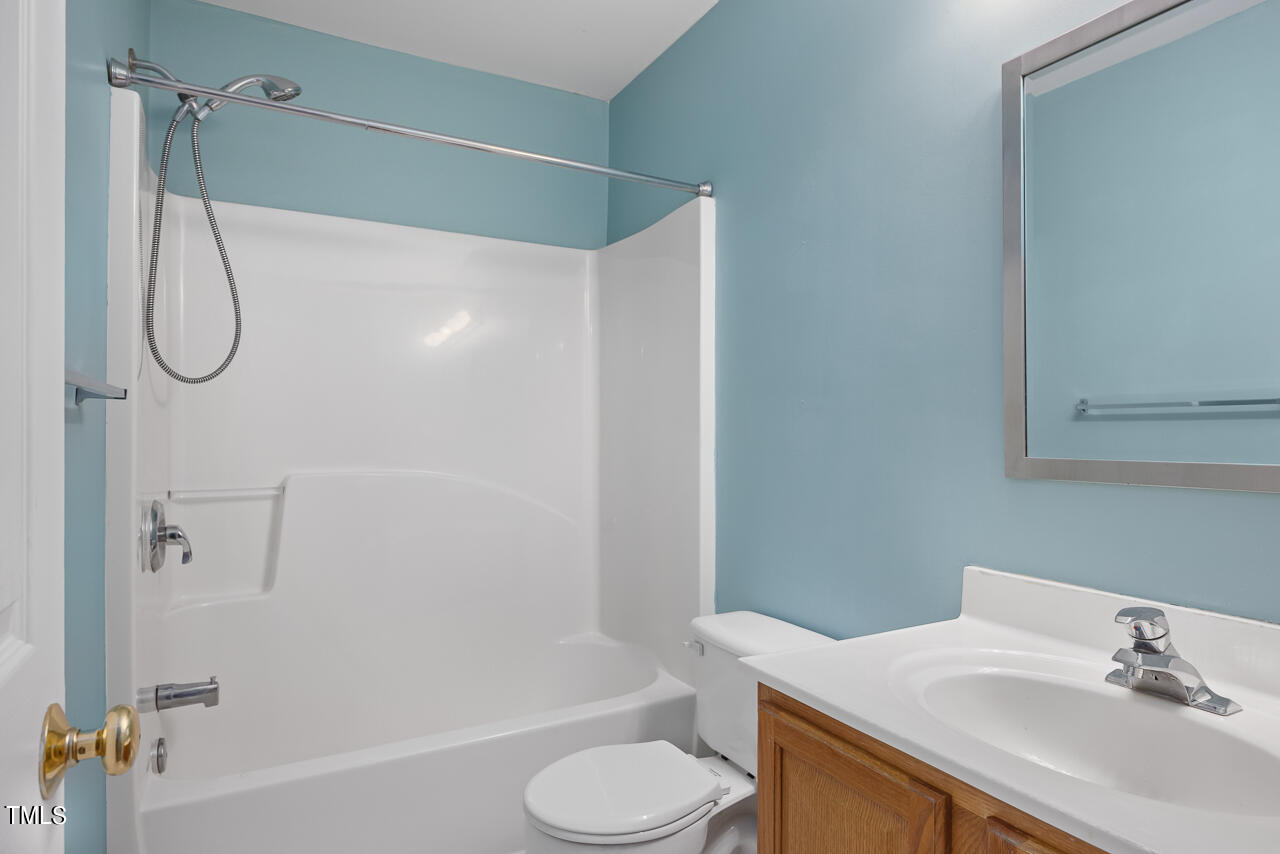 6921 Lamarsh Court Raleigh, NC 27617 - Photo 26 of 37 a bathroom with a sink toilet and shower