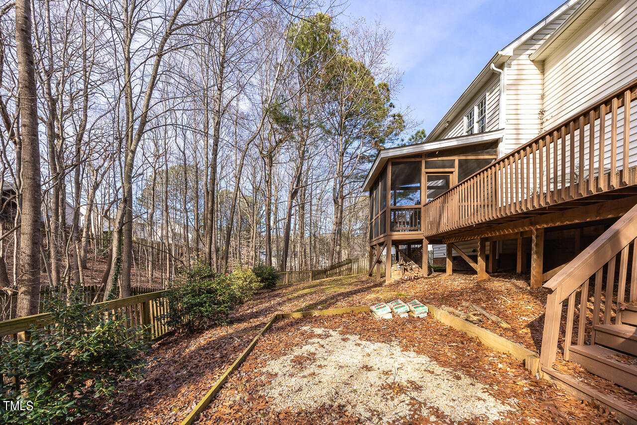 6921 Lamarsh Court Raleigh, NC 27617 - Photo 32 of 37 a house with trees in front of it