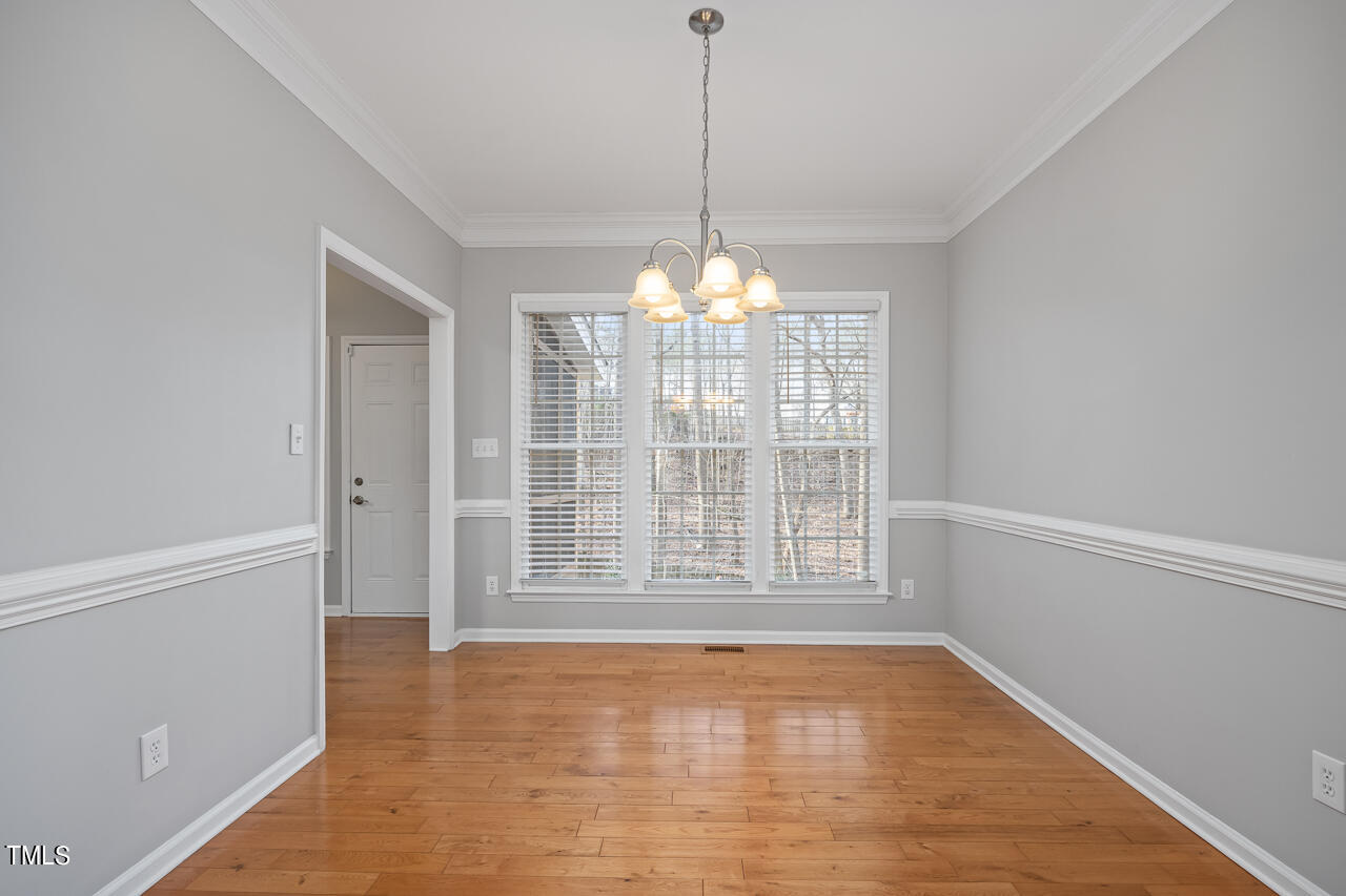 6921 Lamarsh Court Raleigh, NC 27617 - Photo 8 of 37 a view of an empty room with a window