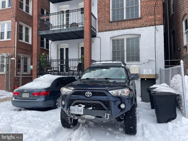 a view of a street with cars