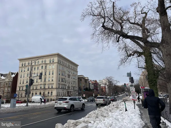 a view of city street with large buildings