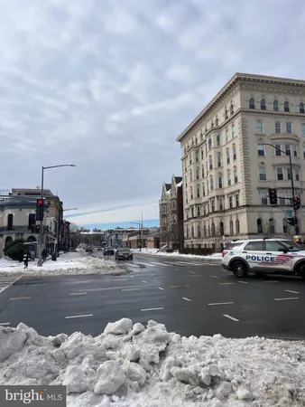 a view of a city street with cars