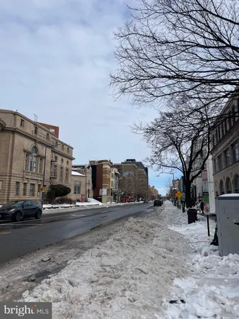 a view of street with parked cars