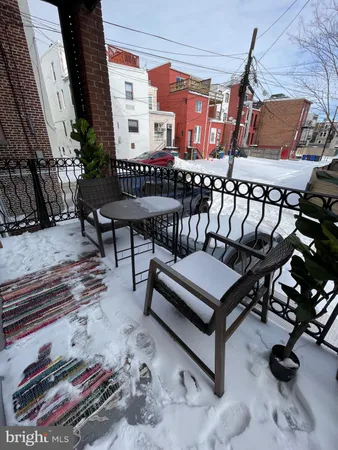 a kitchen with kitchen island a stove a table and chairs in it