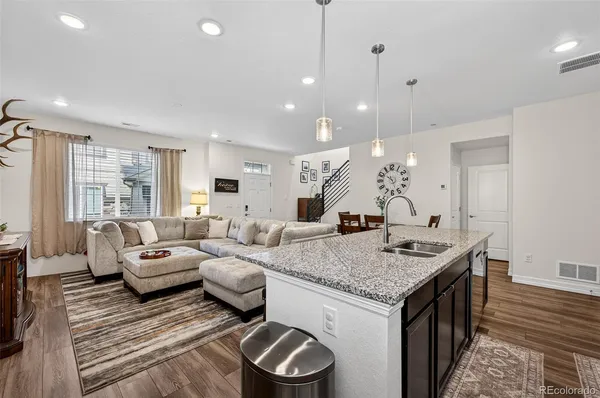 a living room with furniture and a table