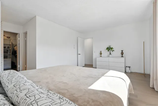 a bedroom with a bed and a cabinets