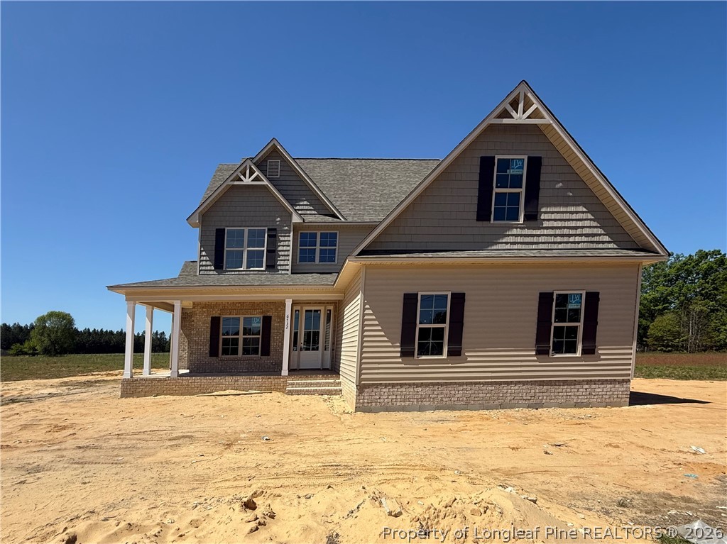 6732 Sim Canady Road Hope Mills, NC 28348 - Photo 1 of 5 a front view of a house with a yard
