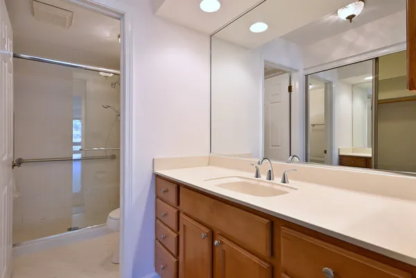 a bathroom with a sink double vanity and a mirror