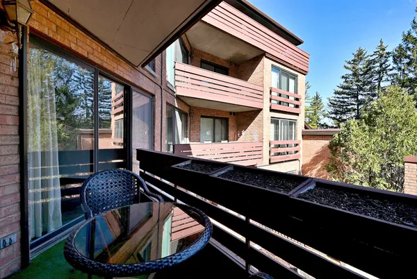 a view of a balcony with chairs