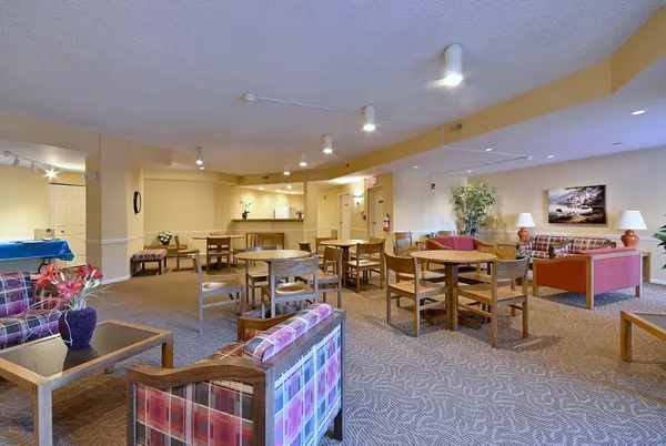 a group of people sitting in a living room