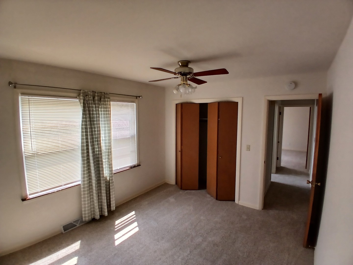 211 North Bothwell Street, Unit 1A Palatine, IL 60067 - Photo 4 of 5 a view of an empty room with a window