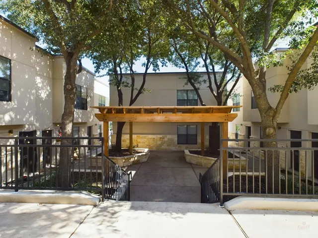 a front view of a building with street view