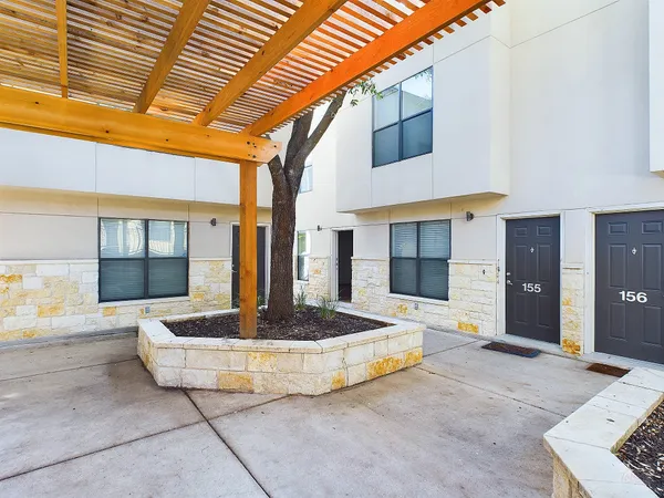 a swimming pool with potted plants