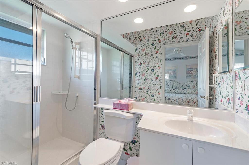 3574 Midas Place Naples, FL 34105 - Photo 23 of 29 a bathroom with a sink toilet and shower