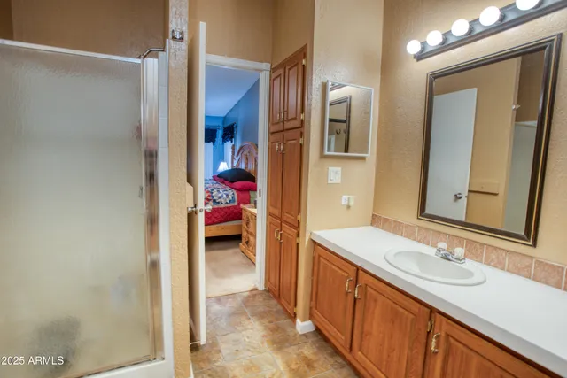 a bedroom with a bed and a desk