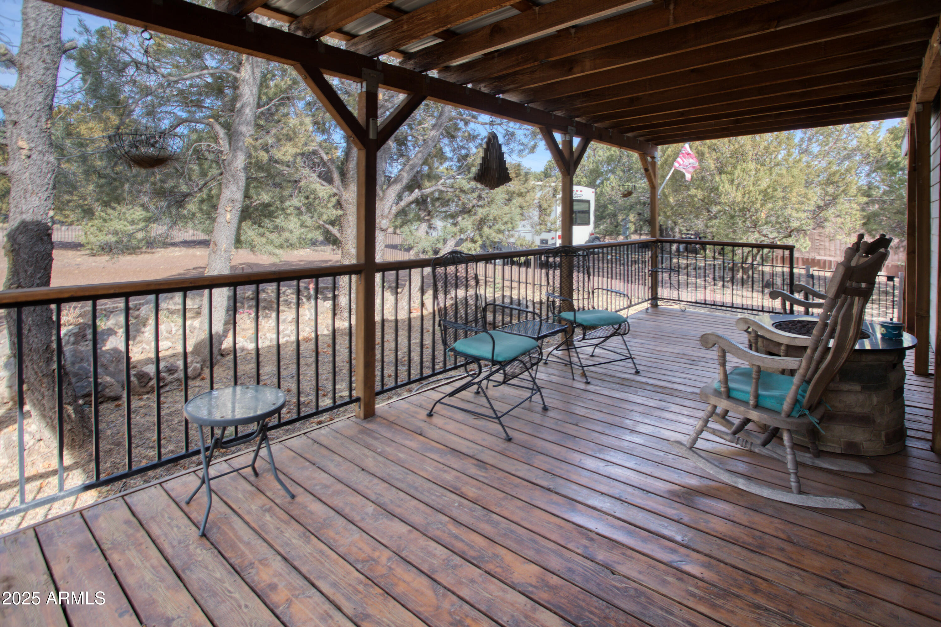 125 County Rd N3077 Show Low, AZ 85901 - Photo 25 of 71 a view of roof deck with wooden floor and outdoor seating