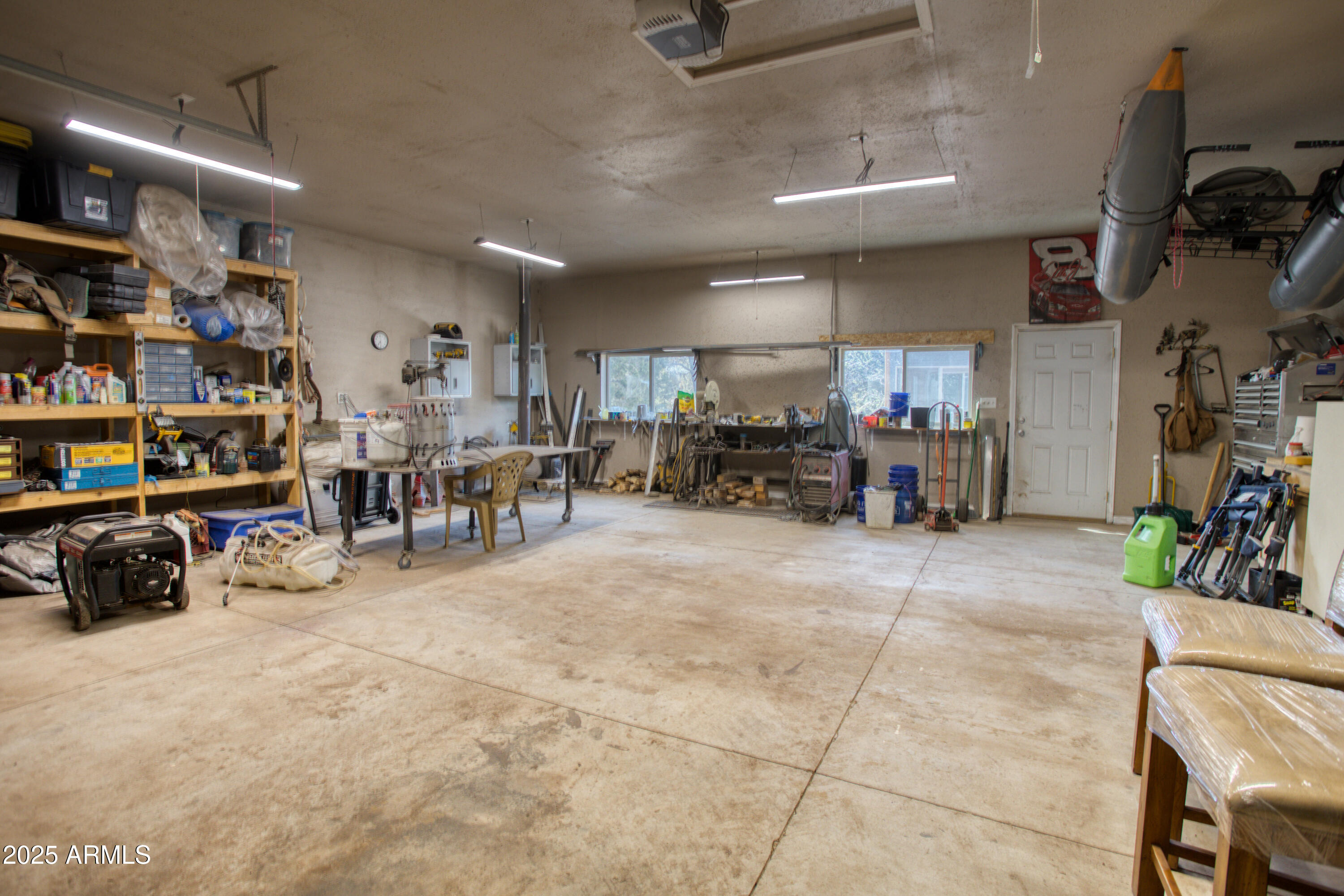 125 County Rd N3077 Show Low, AZ 85901 - Photo 38 of 71 a living room with lots of furniture and a large window