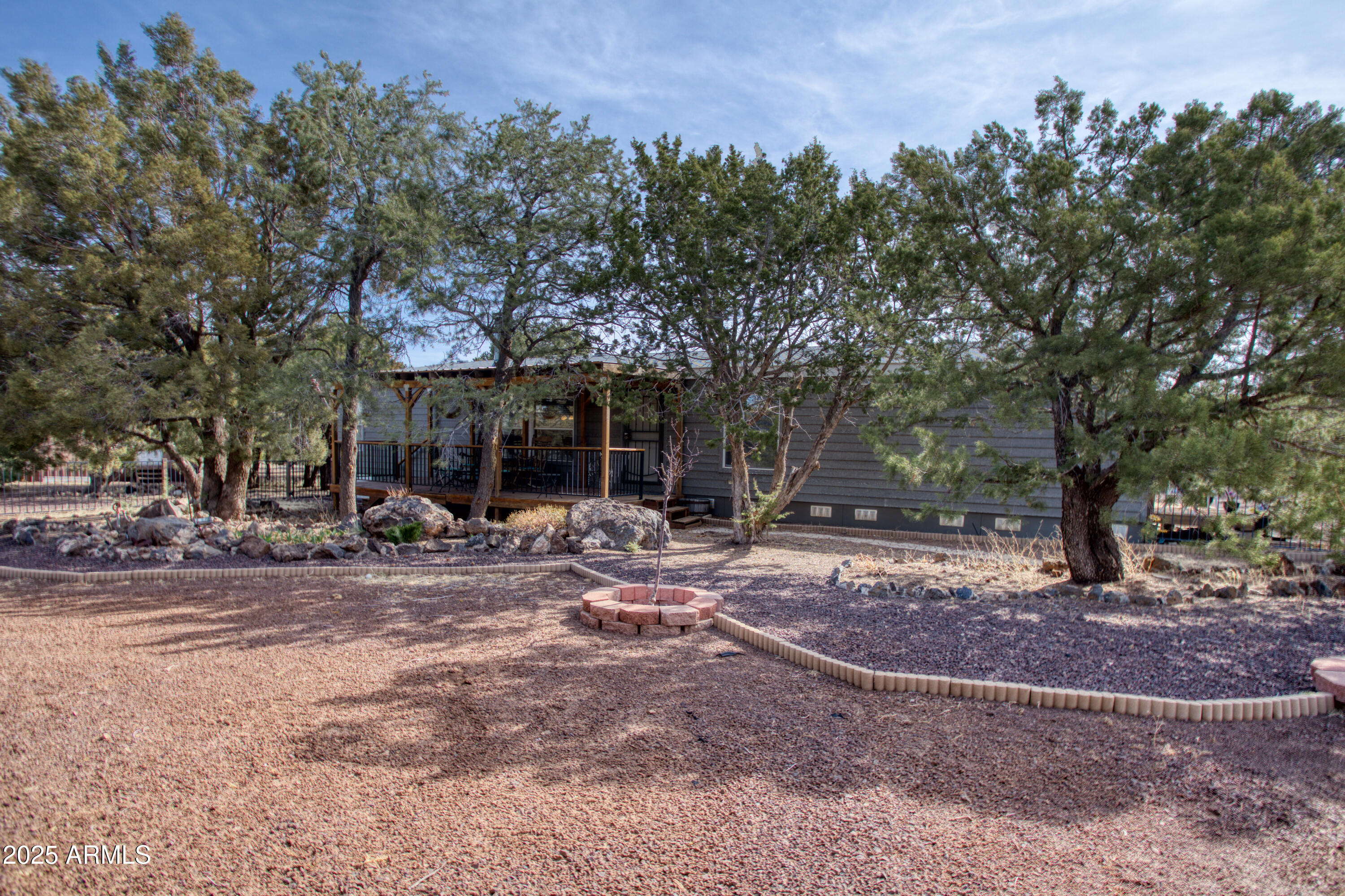 125 County Rd N3077 Show Low, AZ 85901 - Photo 44 of 71 a view of a house with backyard space and a tree