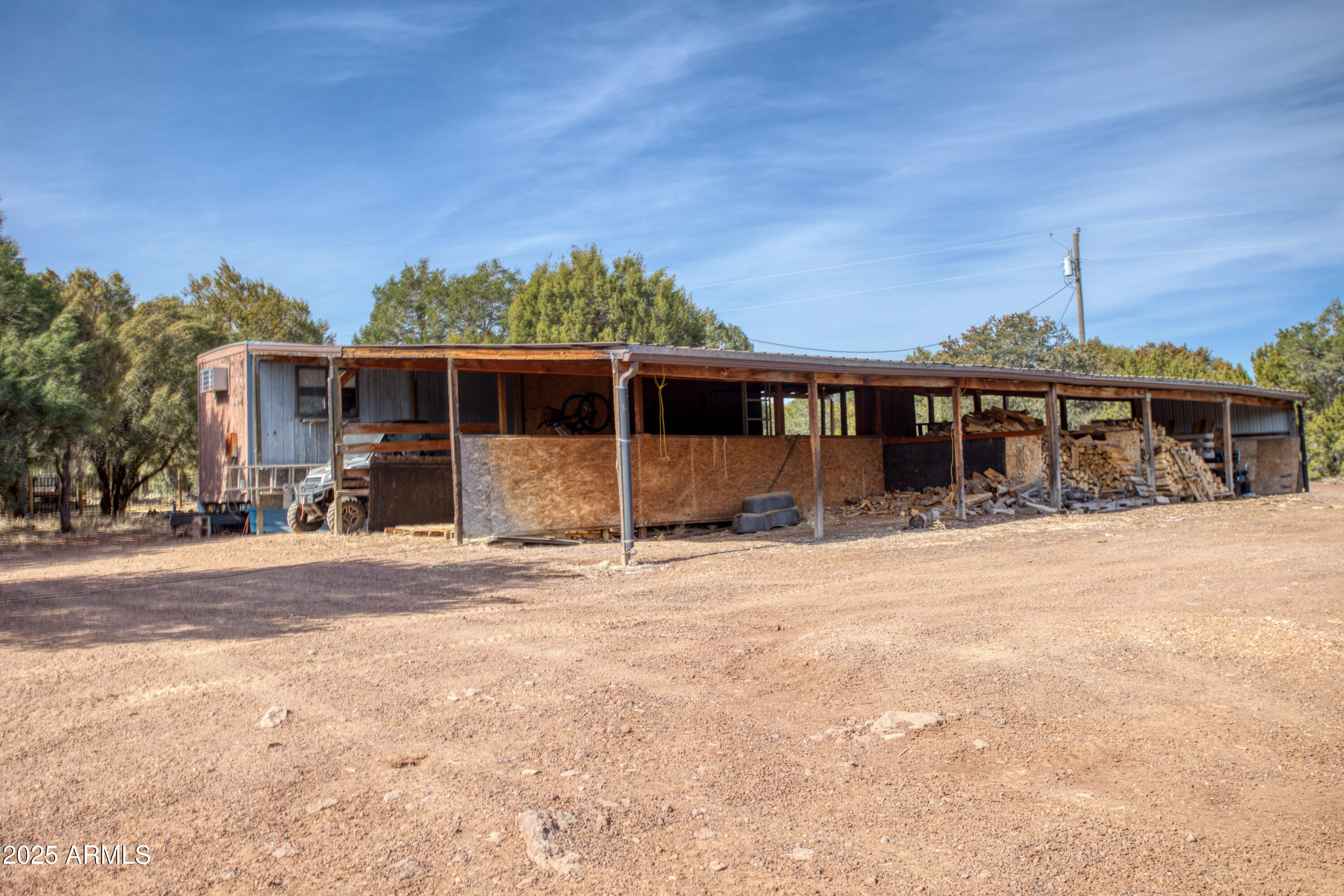 125 County Rd N3077 Show Low, AZ 85901 - Photo 45 of 71 a front view of a house with a yard