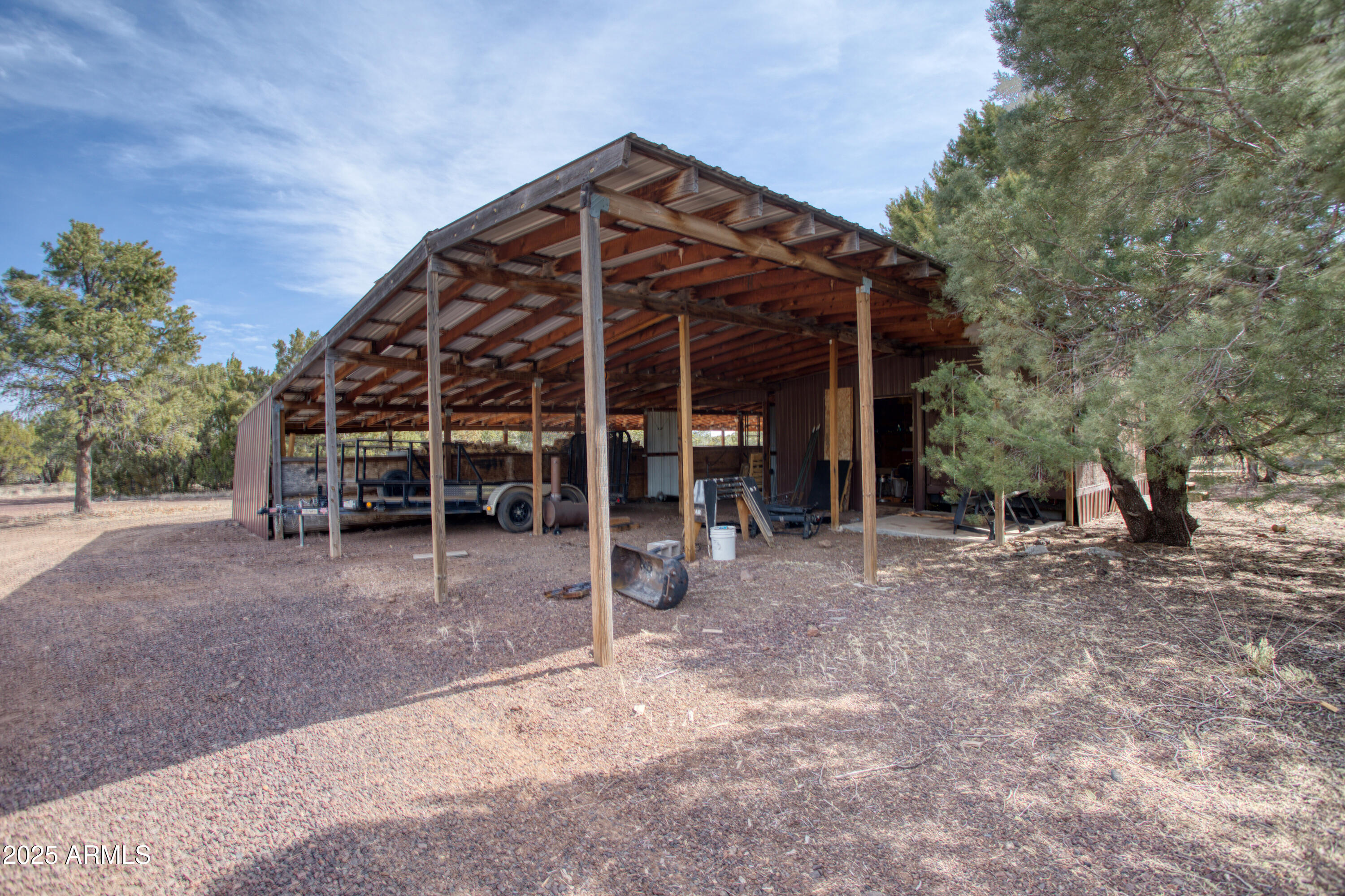 125 County Rd N3077 Show Low, AZ 85901 - Photo 47 of 71 a view of a house with a yard and wooden fence