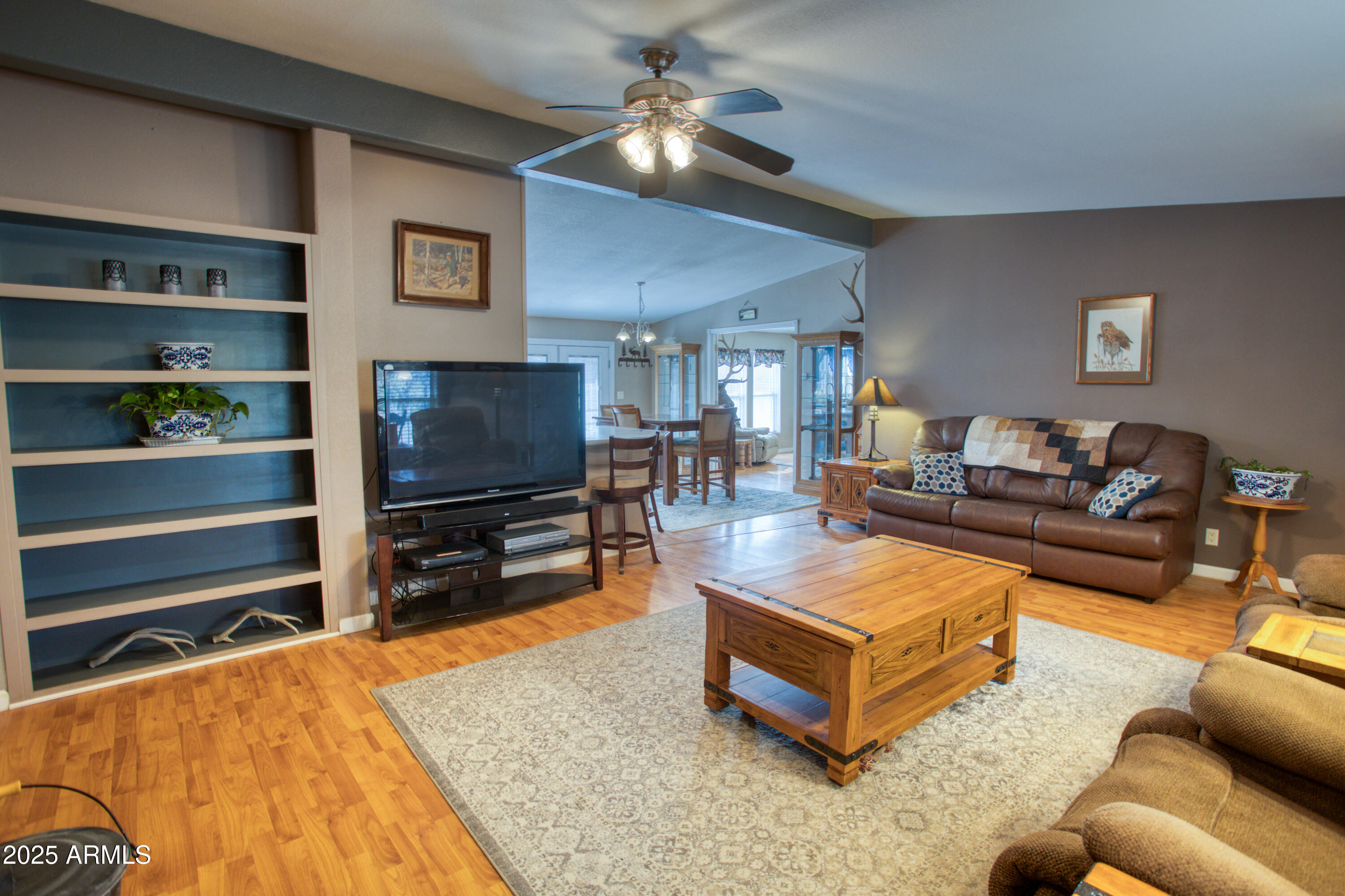 125 County Rd N3077 Show Low, AZ 85901 - Photo 5 of 71 a living room with furniture and a flat screen tv