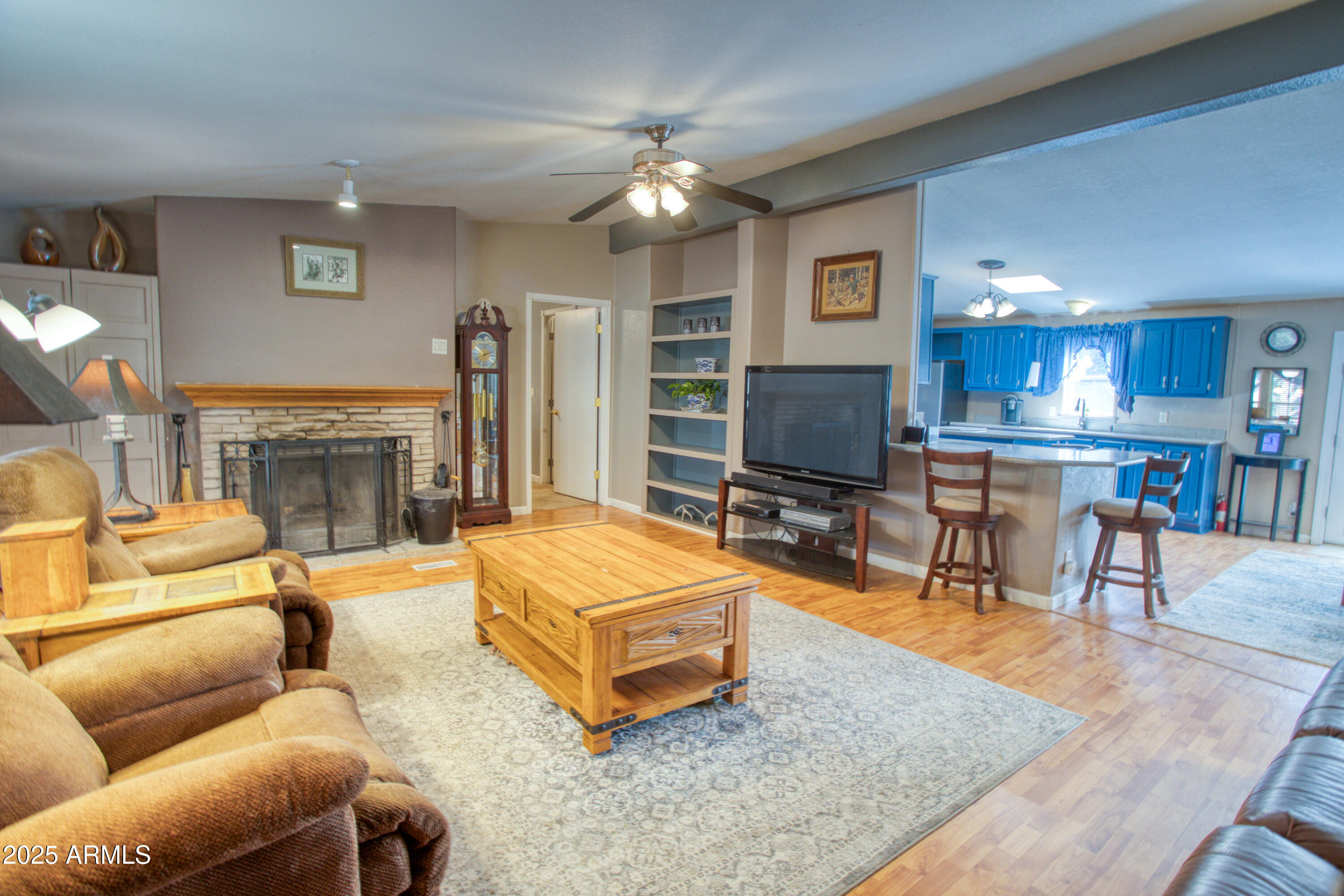 125 County Rd N3077 Show Low, AZ 85901 - Photo 6 of 71 a living room with furniture and a fireplace