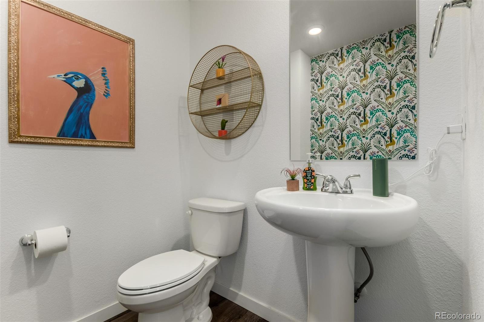 6767 Quivas Way Denver, CO 80221 - Photo 16 of 30 a bathroom with a toilet and a sink