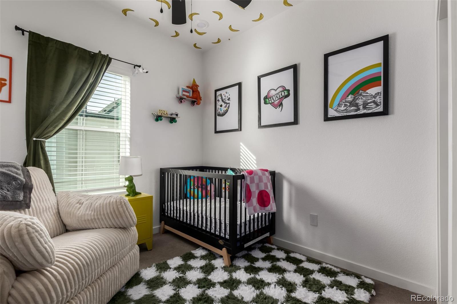 6767 Quivas Way Denver, CO 80221 - Photo 23 of 30 a living room with furniture and a window