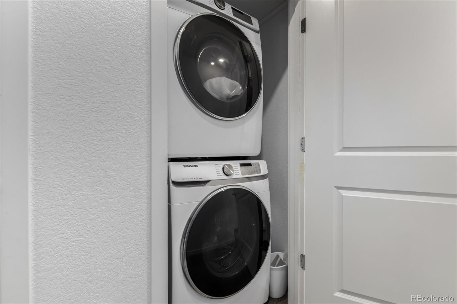 6767 Quivas Way Denver, CO 80221 - Photo 28 of 30 a utility room with dryer and washer
