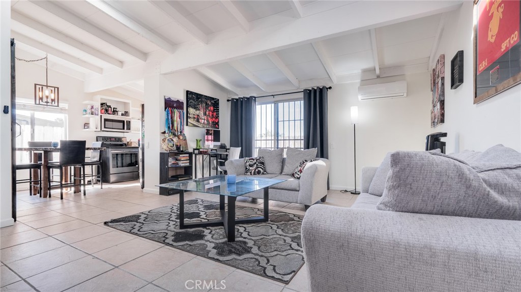 920 Raintree Place Vista, CA 92084 - Photo 14 of 18 a living room with furniture and a large mirror with wooden floor