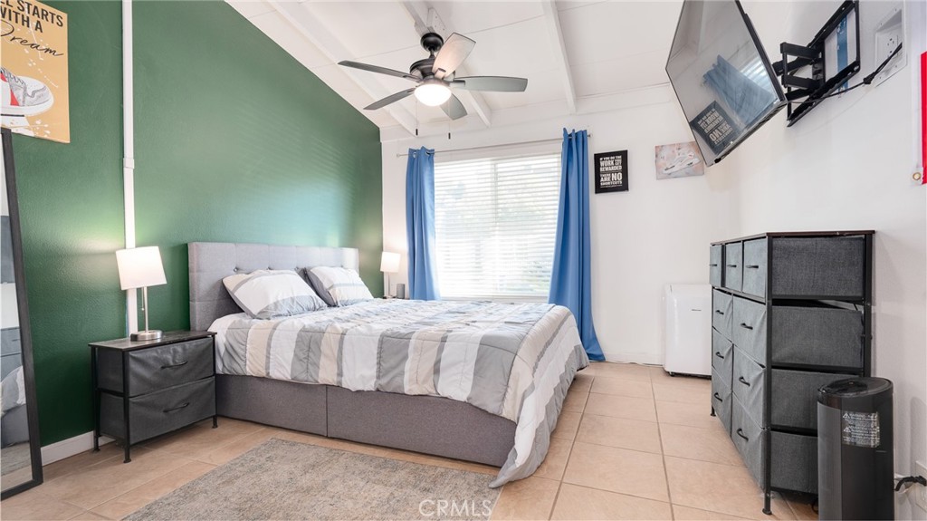 920 Raintree Place Vista, CA 92084 - Photo 7 of 18 a bedroom with a bed and a ceiling fan