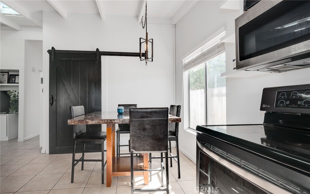 920 Raintree Place Vista, CA 92084 - Photo 10 of 18 a kitchen with a table and chairs