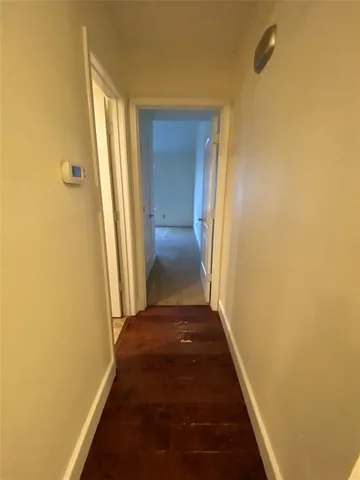 an empty room with a view of a house