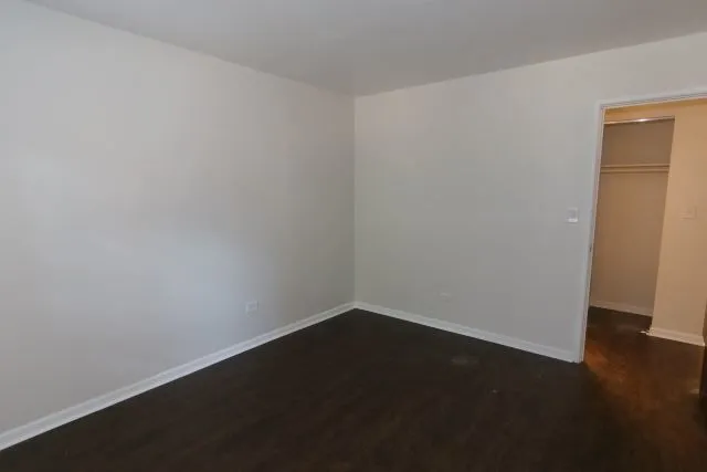 a bathroom with a toilet and shower