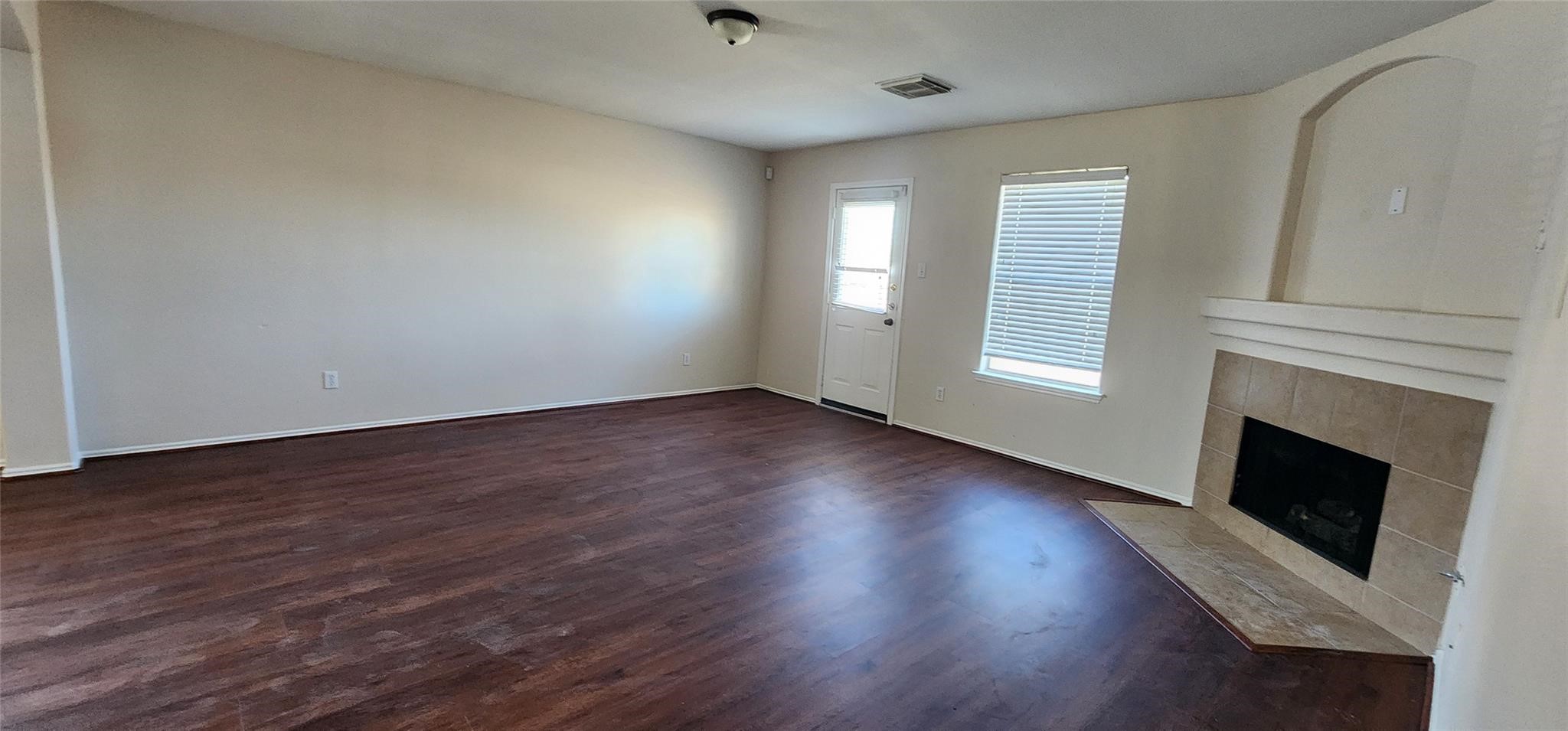 315 Sunset Colony Drive Rosharon, TX 77583 - Photo 10 of 20 a view of an empty room with wooden floor and a window