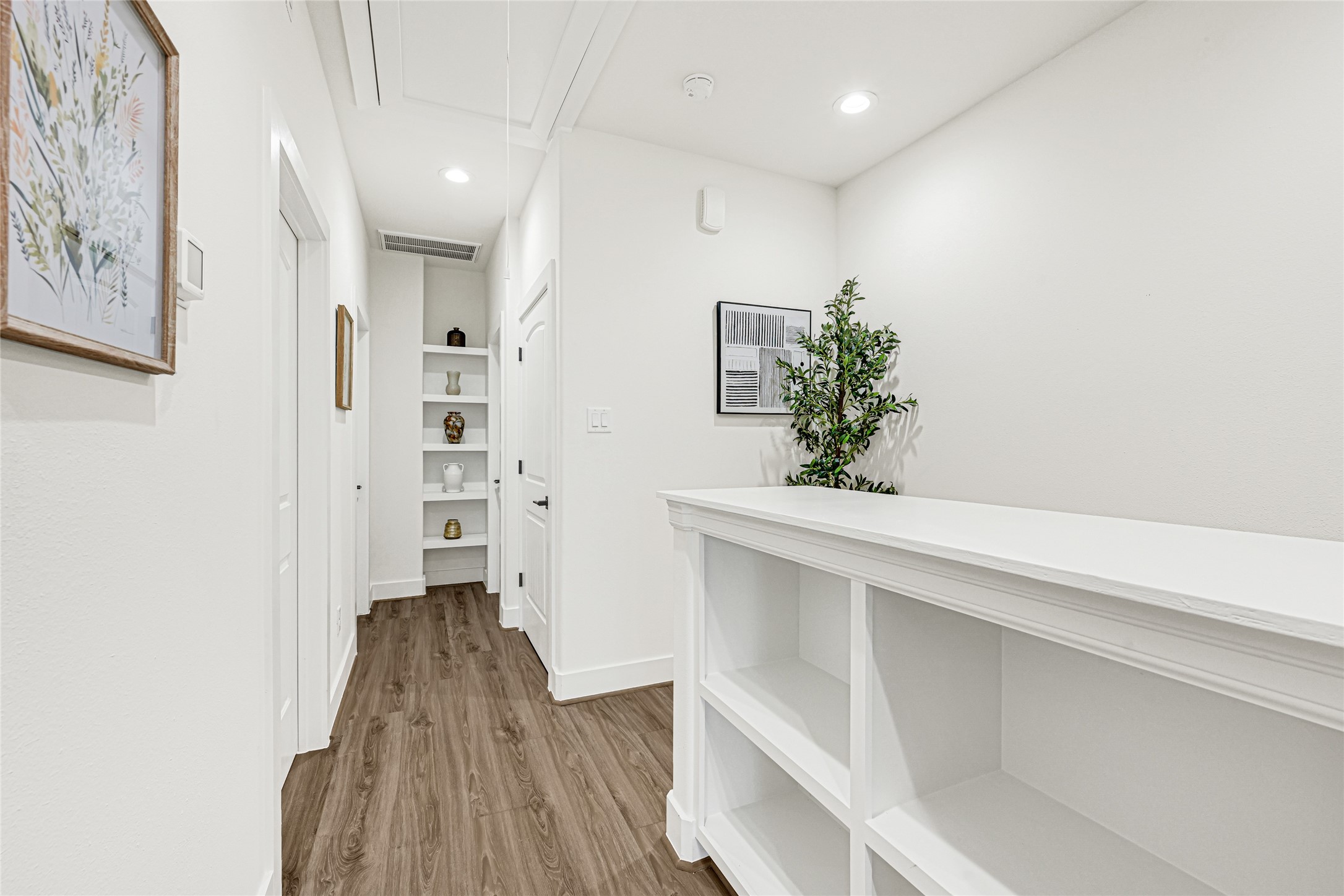 3845 Lydia Street Houston, TX 77021 - Photo 13 of 45 a view of hallway with wooden floor and staircase
