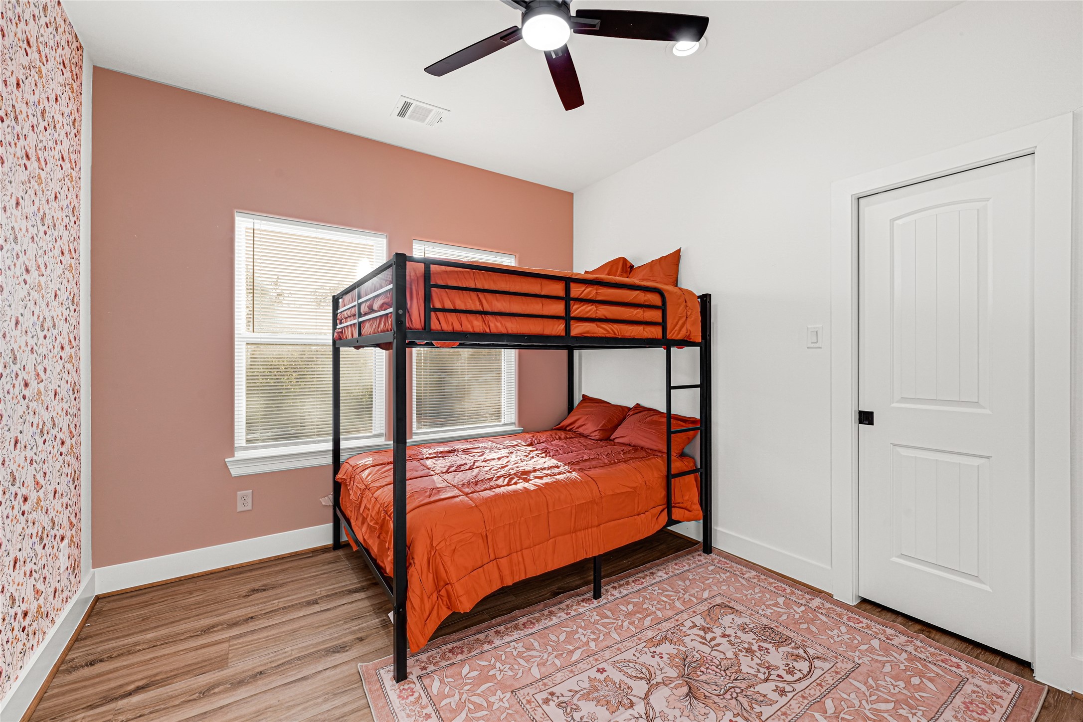 3845 Lydia Street Houston, TX 77021 - Photo 17 of 45 a bedroom with a bed and wooden floor