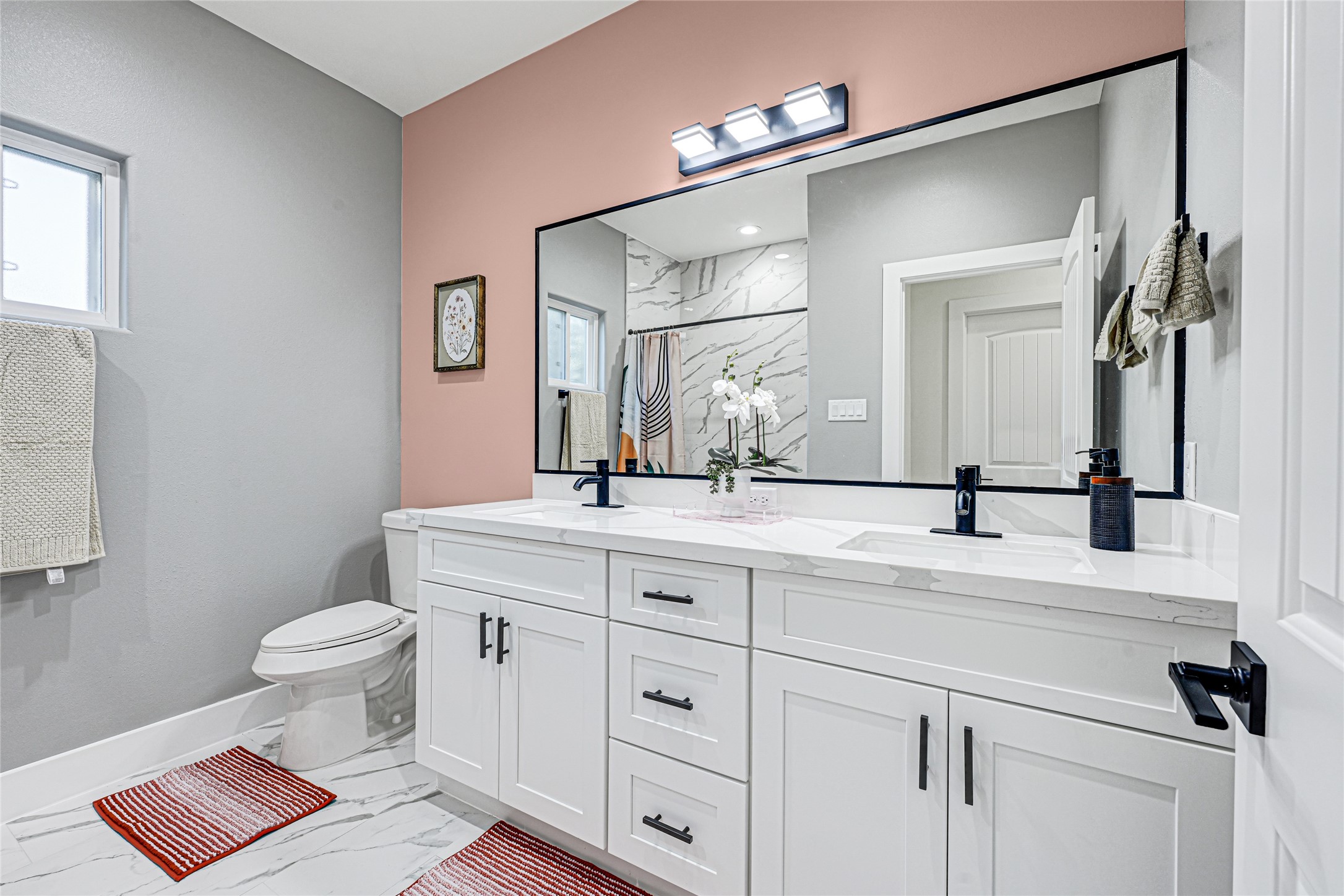 3845 Lydia Street Houston, TX 77021 - Photo 20 of 45 a bathroom with a double vanity sink and a toilet