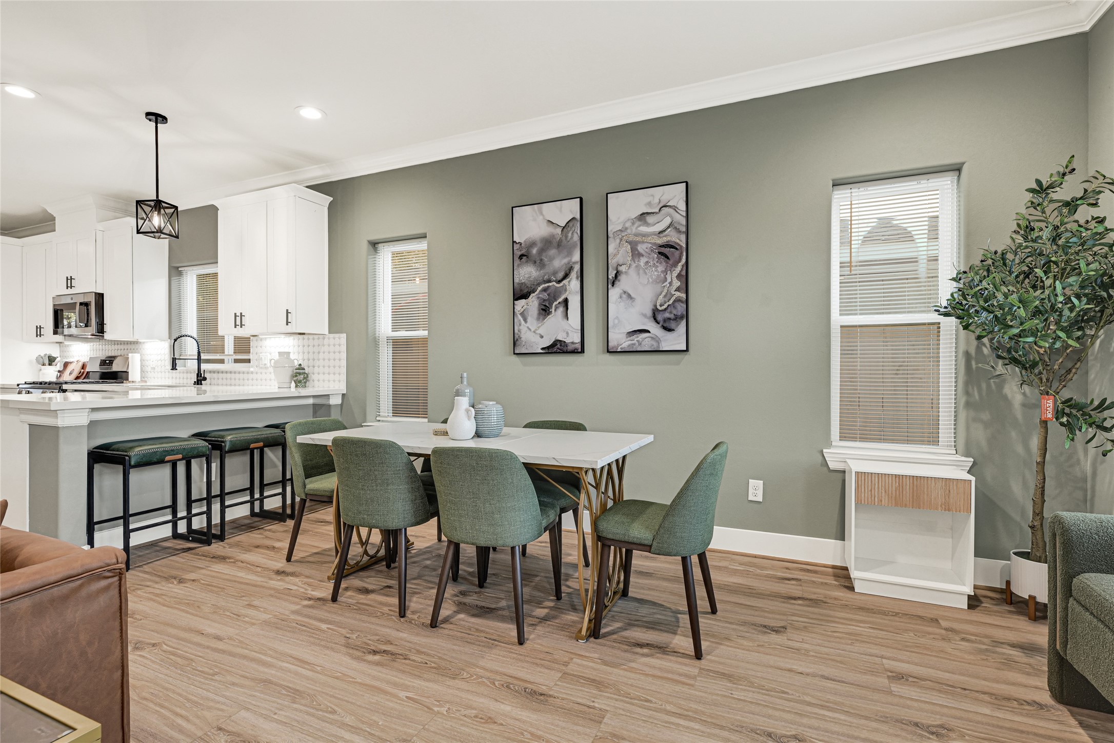 3845 Lydia Street Houston, TX 77021 - Photo 26 of 45 a view of a a dining room with furniture window and wooden floor