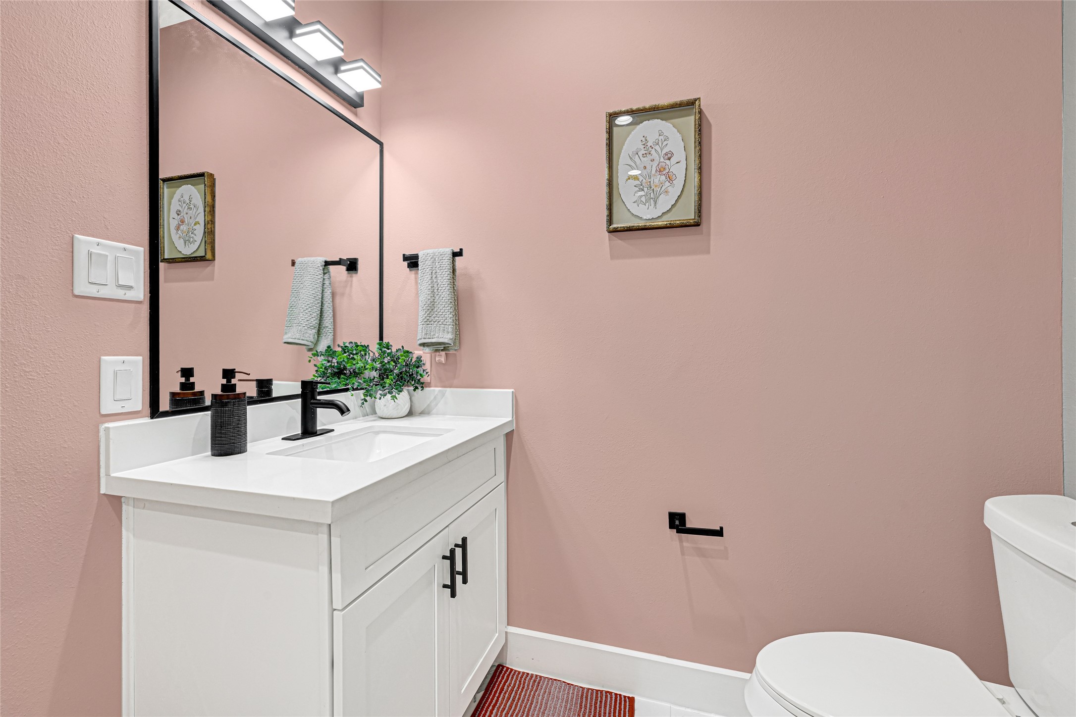 3845 Lydia Street Houston, TX 77021 - Photo 9 of 45 a bathroom with a sink mirror vanity and toilet