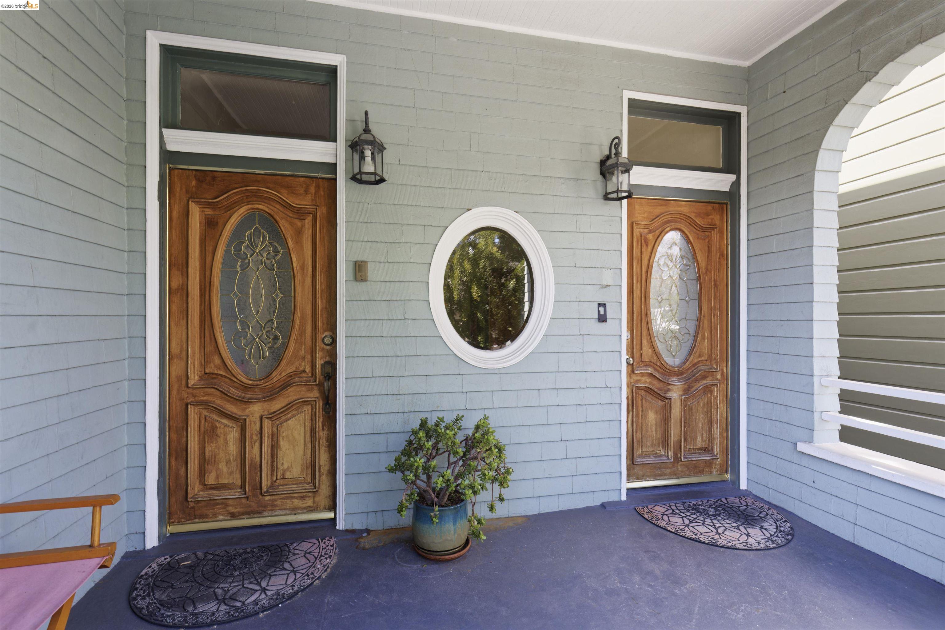 1033 Magnolia Street Oakland, CA 94607 - Photo 2 of 4 a front view of a house with entryway and wooden floor