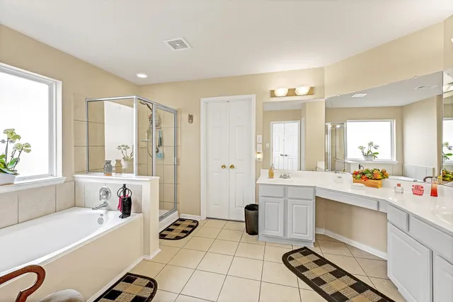 a large white room with mirror and window