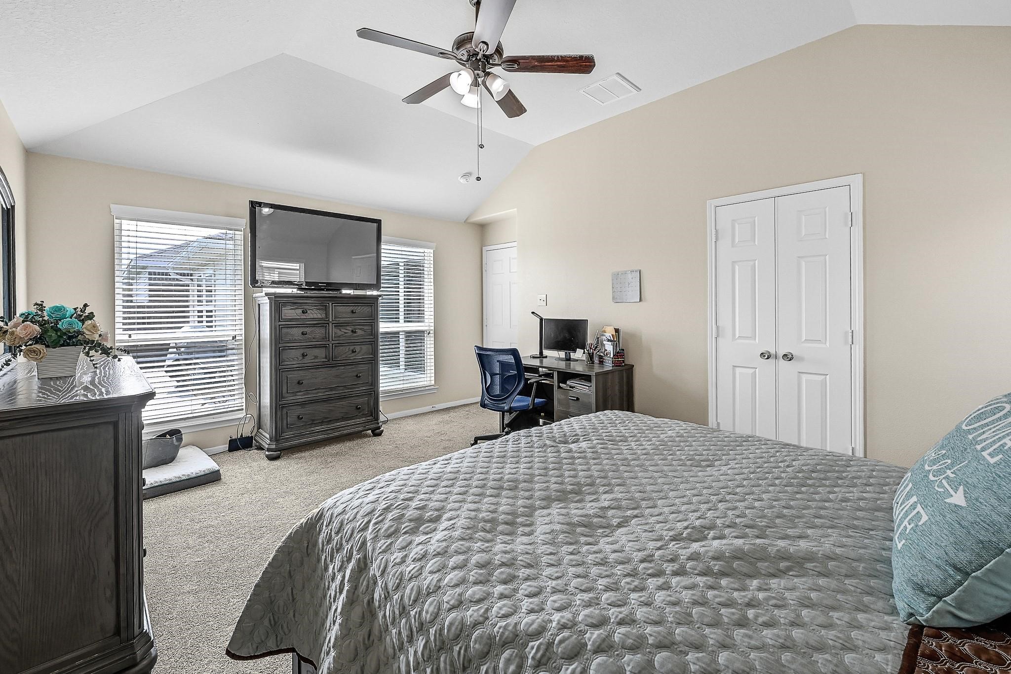 9920 Climbing Tree Street Conroe, TX 77385 - Photo 15 of 19 a large bedroom with bed and window