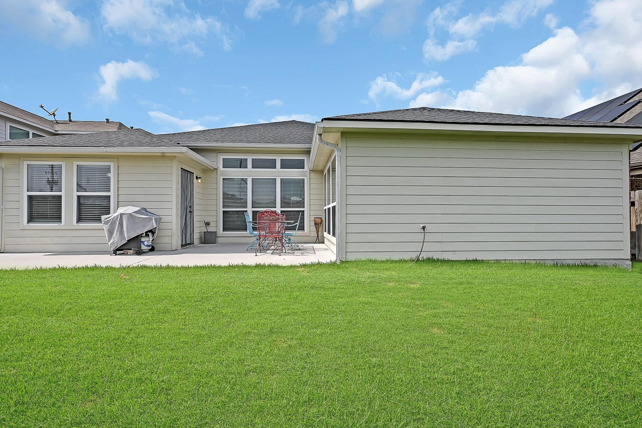 9920 Climbing Tree Street Conroe, TX 77385 - Photo 18 of 19 a view of a house with backyard