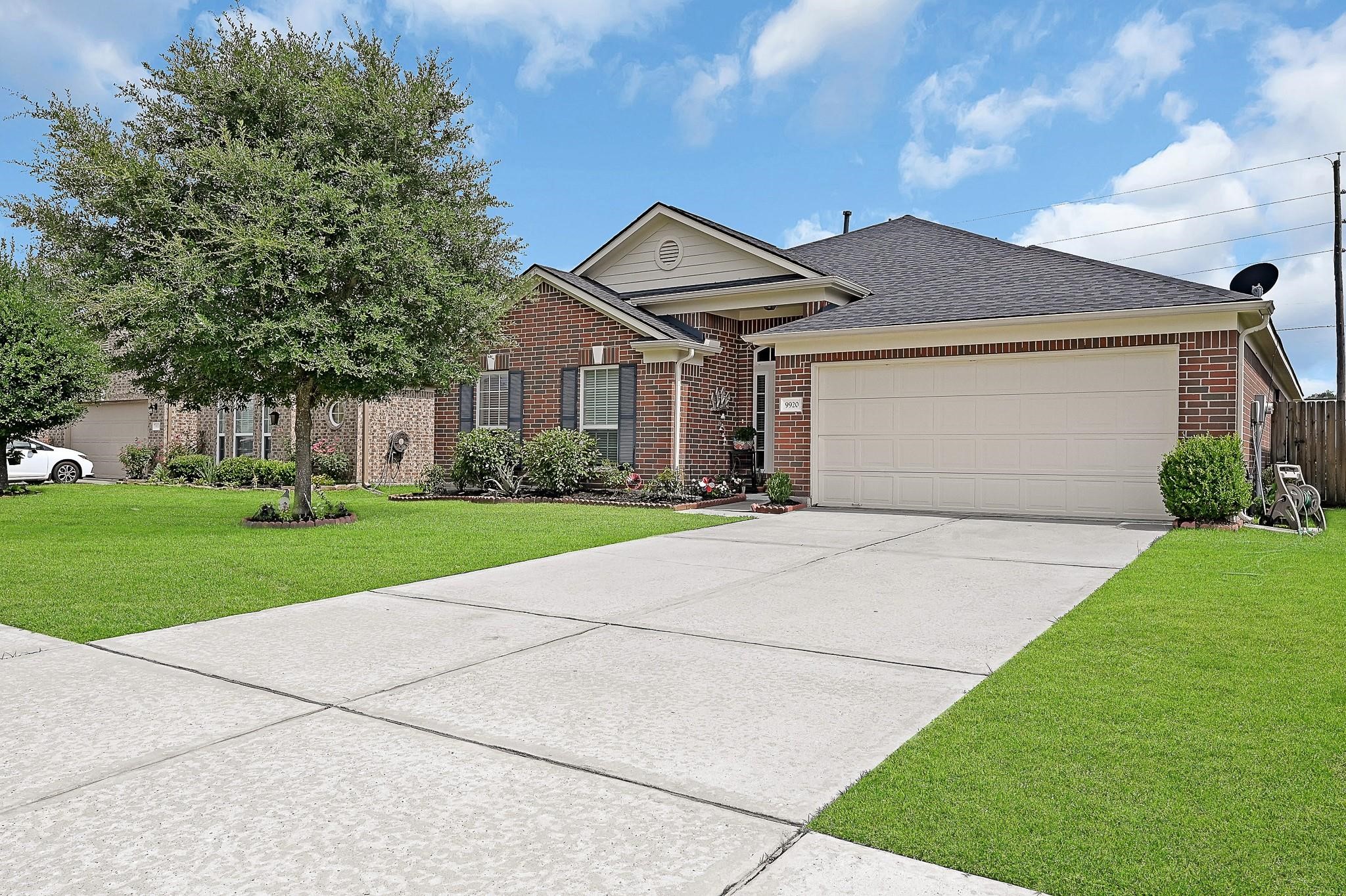 9920 Climbing Tree Street Conroe, TX 77385 - Photo 2 of 19 a front view of house with yard